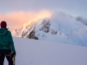 Looking up at Mont Maudit, Mont Blanc (behind Maudit) is on fire as the sun rises over the Mont Blanc massif - Mont Blanc via Trois Monts.