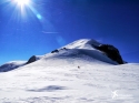 Looking from the top of Dome du Goûter towards the Vallot hut and Boss' Ridge