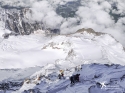 Looking down the start of the descent of the Aiguille, You can see the Tete Rousse Hut the trail to where it crosses the grand Couloir, and then the ridge posing the technical difficulties stretching down and right0