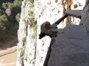 A section that crumbled away entirely, leaving behind only the support beams.