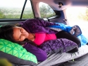 The maternity sleep system, set up in the back of a Subaru Outback.