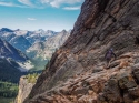 Leonie scrambling to the start of the 'Beckey Route' on Liberty Bell.