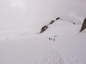 Approaching the Cosmiques Hut (center right) from the Aiguille du Midi with the campers on the glacier (left).