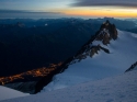 Sometimes you just need to escape the madness before anyone realizes you've escaped.  Looking back on the Aiguille du Midi towering over the Cosmiques Refuge  - Mont Blanc via Trois Monts.